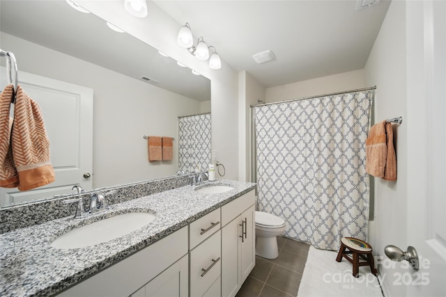 2034 Houle Ln, Charlotte, NC 28214 - bathroom featuring double vanity, toilet, tile patterned floors, and a shower with shower curtain