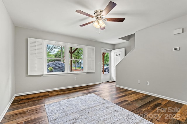 729 Tenth Ave NE, Hickory, NC 28601 - spare room with a ceiling fan, baseboards, and dark wood-type flooring