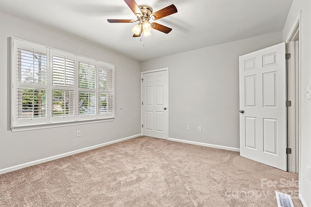 729 Tenth Ave NE, Hickory, NC 28601 - unfurnished bedroom with carpet floors, baseboards, and a ceiling fan