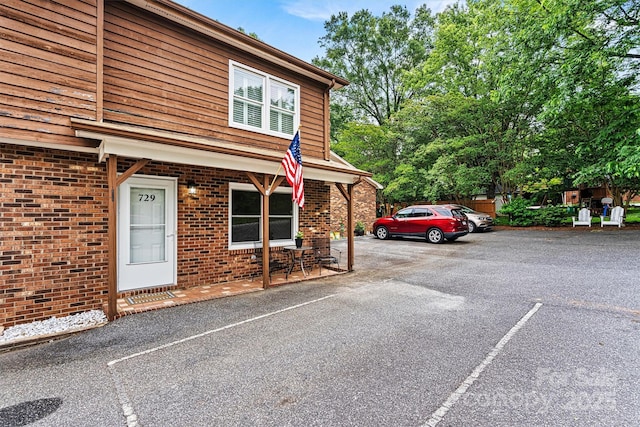 729 Tenth Ave NE, Hickory, NC 28601 - doorway to property with uncovered parking and brick siding