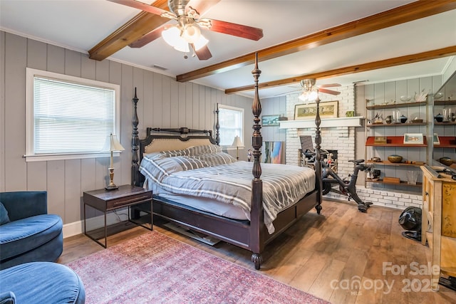 1645 Brookdale Ave, Charlotte, NC 28210 - bedroom with hardwood / wood-style flooring, beamed ceiling, and a fireplace