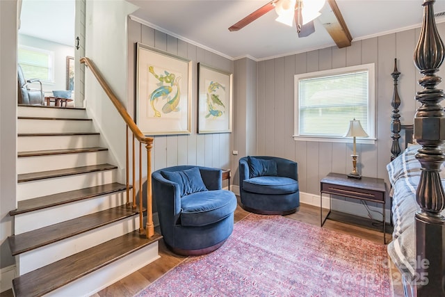 1645 Brookdale Ave, Charlotte, NC 28210 - sitting room featuring healthy amount of natural light, wood finished floors, stairs, ceiling fan, and ornamental molding