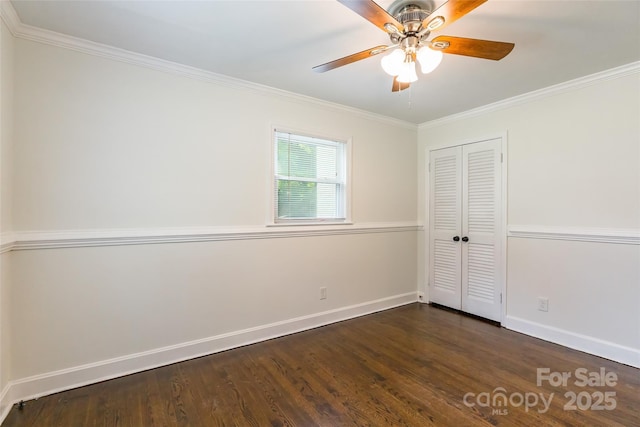 1645 Brookdale Ave, Charlotte, NC 28210 - unfurnished bedroom with crown molding, dark wood finished floors, a closet, and a ceiling fan