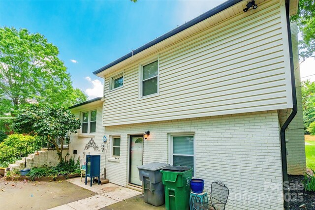1645 Brookdale Ave, Charlotte, NC 28210 - rear view of property featuring a patio area and brick siding
