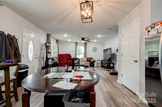 812 Kings Rd, Shelby, NC 28150 - dining area featuring crown molding, light wood finished floors, recessed lighting, a ceiling fan, and a chandelier