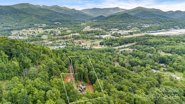 43 Dillingham Estates Trl, Swannanoa, NC 28778 - aerial overview of property's location with property boundaries highlighted, a heavily wooded area, and mountains