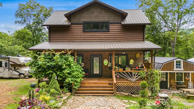 43 Dillingham Estates Trl, Swannanoa, NC 28778 - view of front of home featuring covered porch, faux log siding, and metal roof