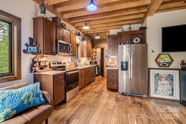 43 Dillingham Estates Trl, Swannanoa, NC 28778 - kitchen with stainless steel appliances, a sink, beam ceiling, and light wood-type flooring