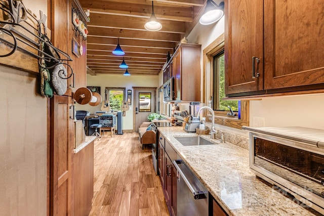 43 Dillingham Estates Trl, Swannanoa, NC 28778 - kitchen with appliances with stainless steel finishes, a sink, light wood finished floors, beam ceiling, and light stone counters