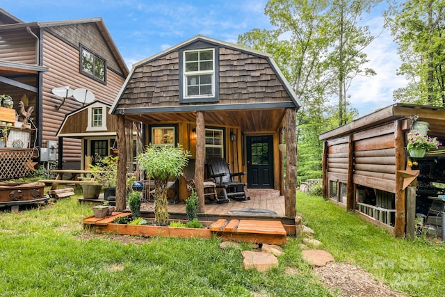 43 Dillingham Estates Trl, Swannanoa, NC 28778 - back of property featuring a gambrel roof and a yard