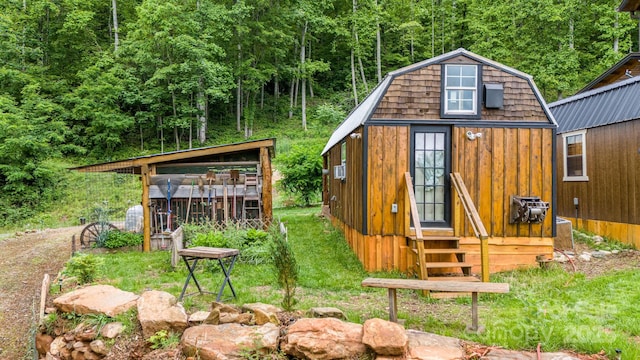 43 Dillingham Estates Trl, Swannanoa, NC 28778 - view of outbuilding featuring a wooded view and entry steps