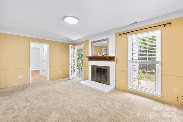 7528 Red Oak Ln, Charlotte, NC 28226 - unfurnished living room with crown molding, plenty of natural light, carpet flooring, and a fireplace