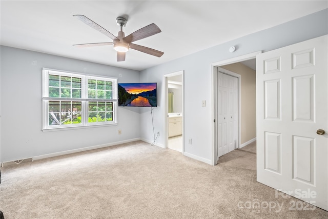 7528 Red Oak Ln, Charlotte, NC 28226 - unfurnished bedroom featuring carpet flooring, ensuite bathroom, and ceiling fan
