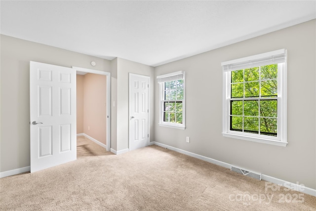 7528 Red Oak Ln, Charlotte, NC 28226 - unfurnished bedroom featuring carpet flooring and a closet