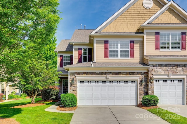 714 Deerbrook Ln, Tega Cay, SC 29708 - craftsman inspired home featuring a garage, concrete driveway, stone siding, and a front yard