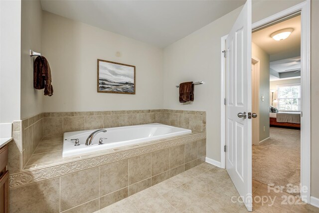 714 Deerbrook Ln, Tega Cay, SC 29708 - ensuite bathroom featuring a garden tub, tile patterned floors, and vanity