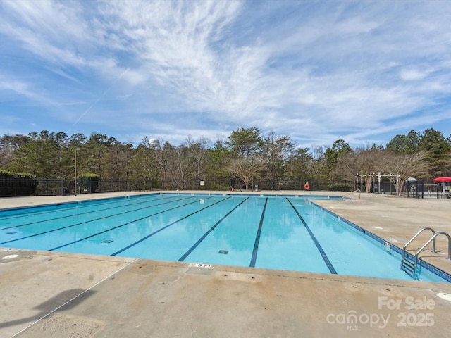 714 Deerbrook Ln, Tega Cay, SC 29708 - community pool with view of scattered trees and a patio