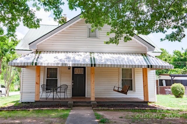 505 S Eastway Dr, Troutman, NC 28166 - view of front of home featuring covered porch and a metal roof