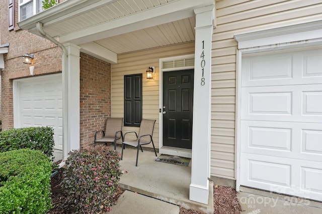 14018 Drake Watch Ln, Charlotte, NC 28262 - property entrance with covered porch and brick siding