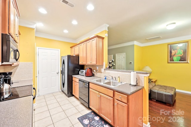 14018 Drake Watch Ln, Charlotte, NC 28262 - kitchen with black appliances, a sink, crown molding, a peninsula, and recessed lighting
