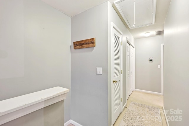 14018 Drake Watch Ln, Charlotte, NC 28262 - corridor with attic access and baseboards