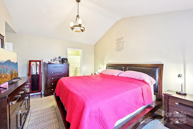 14018 Drake Watch Ln, Charlotte, NC 28262 - bedroom with vaulted ceiling, a chandelier, ensuite bath, and carpet flooring