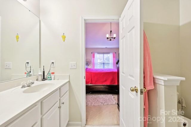 14018 Drake Watch Ln, Charlotte, NC 28262 - ensuite bathroom with vanity, baseboards, and a chandelier