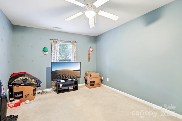 14018 Drake Watch Ln, Charlotte, NC 28262 - sitting room with ceiling fan, carpet flooring, and baseboards