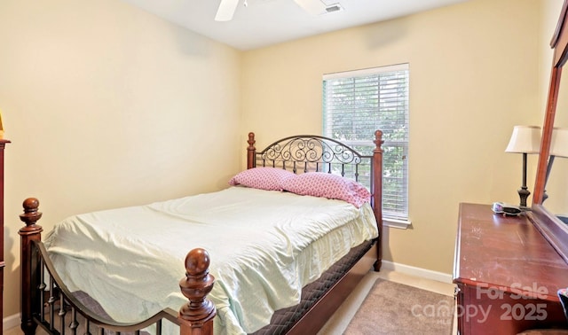14018 Drake Watch Ln, Charlotte, NC 28262 - bedroom with baseboards and ceiling fan