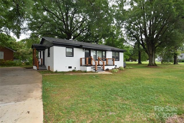 706 Mcintyre St, Monroe, NC 28110 - view of front of home with concrete driveway, a front yard, and crawl space