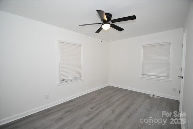 706 Mcintyre St, Monroe, NC 28110 - spare room featuring wood finished floors, baseboards, and ceiling fan