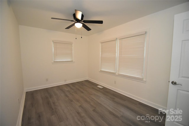 706 Mcintyre St, Monroe, NC 28110 - empty room featuring dark wood finished floors, ceiling fan, and baseboards