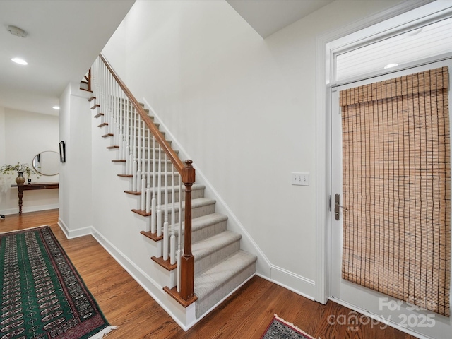 4644 Snow Dr, Harrisburg, NC 28075 - stairs with recessed lighting, wood finished floors, and baseboards