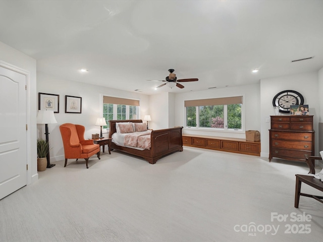 4644 Snow Dr, Harrisburg, NC 28075 - bedroom with light carpet, multiple windows, recessed lighting, a ceiling fan, and baseboards