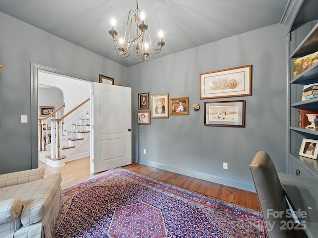 4644 Snow Dr, Harrisburg, NC 28075 - office featuring wood finished floors, a chandelier, and baseboards