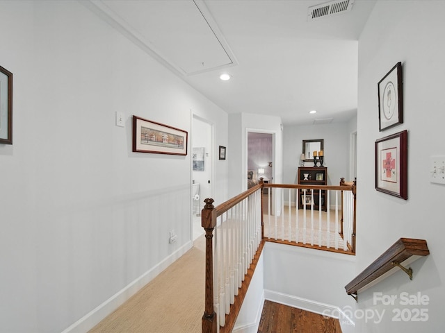 4644 Snow Dr, Harrisburg, NC 28075 - hall with attic access, an upstairs landing, baseboards, recessed lighting, and wood finished floors