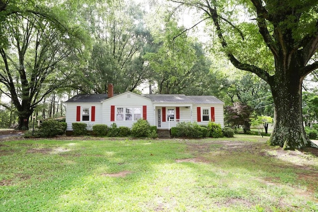 1270 N Enochville Ave, China Grove, NC 28023 - view of front facade with a front lawn, a porch, and a chimney