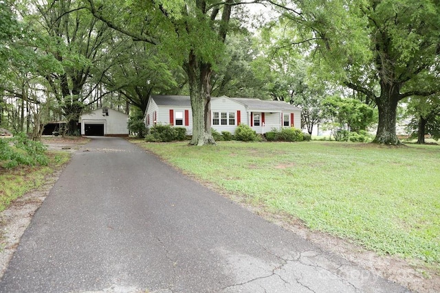 1270 N Enochville Ave, China Grove, NC 28023 - single story home featuring an outdoor structure, a front lawn, and a garage