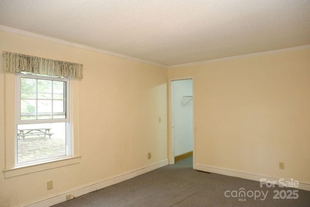 1270 N Enochville Ave, China Grove, NC 28023 - spare room featuring a textured ceiling, crown molding, dark carpet, and baseboards