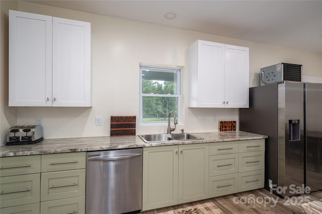 3103 Richview Dr, Crouse, NC 28033 - kitchen with appliances with stainless steel finishes, a sink, light wood-style flooring, white cabinets, and light stone countertops
