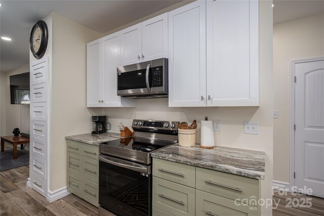 3103 Richview Dr, Crouse, NC 28033 - kitchen with appliances with stainless steel finishes, dark wood finished floors, light stone countertops, recessed lighting, and baseboards