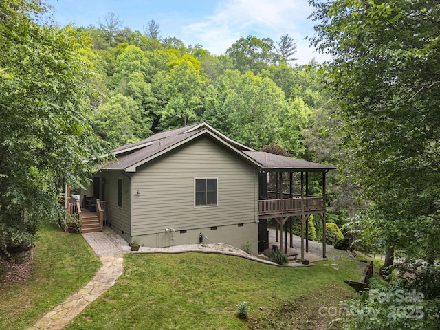 305 Pound Mill Branch Rd, Green Mountain, NC 28740 - rear view of property featuring a yard, crawl space, a sunroom, and a deck