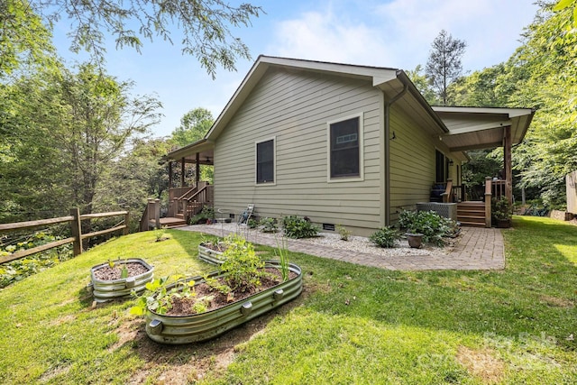 305 Pound Mill Branch Rd, Green Mountain, NC 28740 - back of house with a vegetable garden, stairway, and crawl space