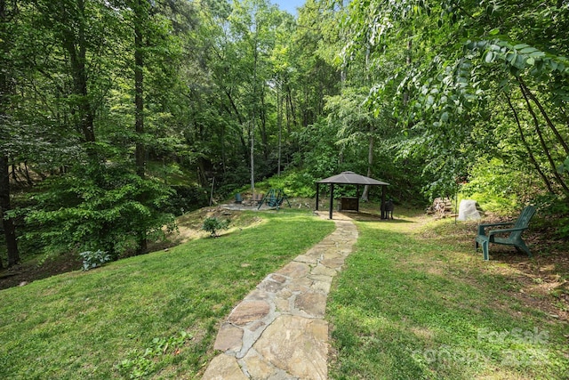 305 Pound Mill Branch Rd, Green Mountain, NC 28740 - view of green lawn featuring a gazebo and a view of trees