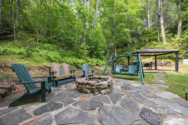 305 Pound Mill Branch Rd, Green Mountain, NC 28740 - view of patio / terrace with a gazebo, a fire pit, and a forest view