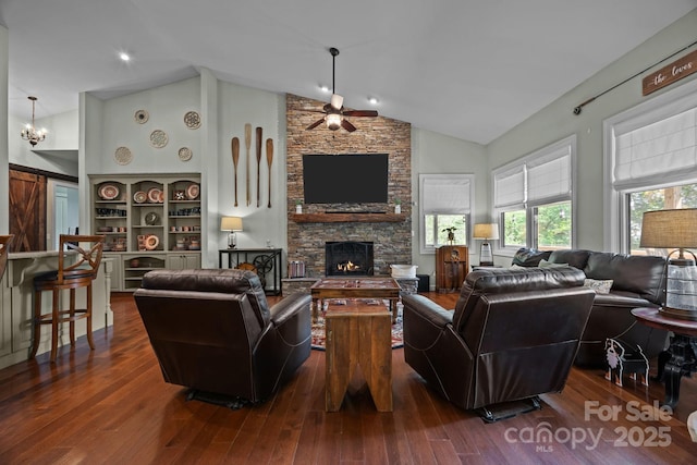 305 Pound Mill Branch Rd, Green Mountain, NC 28740 - living area with a ceiling fan, a fireplace, dark wood-style flooring, and high vaulted ceiling