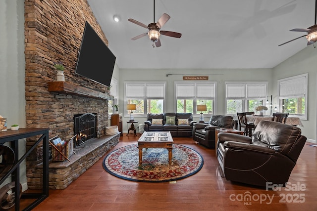 305 Pound Mill Branch Rd, Green Mountain, NC 28740 - living area featuring ceiling fan, high vaulted ceiling, wood finished floors, a stone fireplace, and baseboards