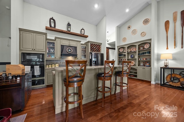 305 Pound Mill Branch Rd, Green Mountain, NC 28740 - kitchen featuring black appliances, under cabinet range hood, dark wood finished floors, light countertops, and recessed lighting