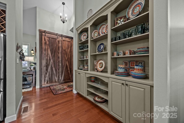 305 Pound Mill Branch Rd, Green Mountain, NC 28740 - entryway featuring dark wood-style flooring, a chandelier, and baseboards