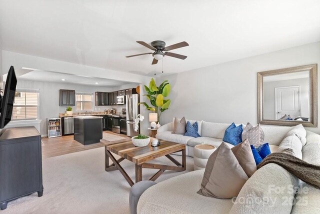 999 Rushing Ln Unit 13, Fort Mill, SC 29715 - living area with wine cooler, ceiling fan, and light wood-type flooring